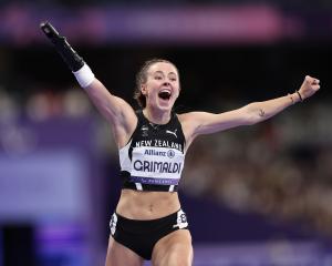 Anna Grimaldi celebrates after winning bronze during the women's T47 100m final. PHOTOS: FIONA...