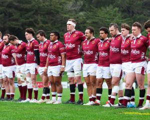 Southland players observe a moment of silence in memory of Norm Hewitt during the round five...