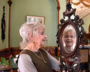 Larnach Castle founding director Margaret Barker examines one of two mirrors made by master...