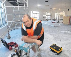 Rangiora Presbyterian minister Rev Jason King gets the feel of his new pulpit area inside the new...