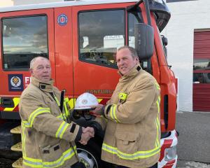 James Hazlett (right) hands over Ranfurly’s fire chief responsibilities to William Dowling. PHOTO...