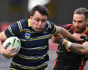 Otago Whalers centre Aleki Morris-Lome has the tryline in sight as he brushes off the tackle of...