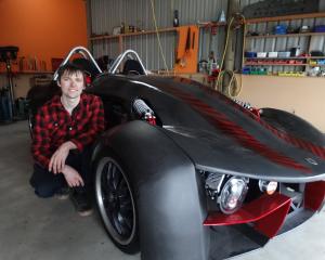 Oamaru man Josh Lee with his scratch-built car that he plans to enter in Oamaru drag racing and...