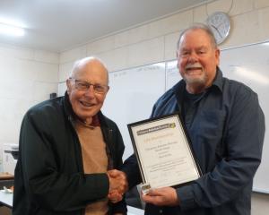 North Otago Citizens Advice Bureau chairman Paul Hebden (right) presents Alan Kerby with his...