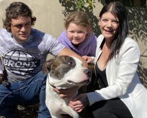 Quaid Brennan and Millie Russell, with Ariella Russell (8), said Onyx was a "loving dog". Photo:...