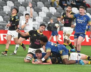 Otago openside flanker Lucas Casey shows his delight as he crosses for a try against Wellington...