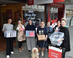 HeadQuarters Hairdressing George St staff (from left) Sariah Krueger, Tania Downer, Isabelle...