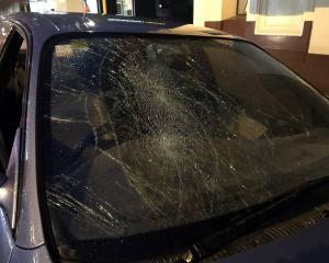 The driver’s window and windscreen of a car parked in lower Stuart St were smashed on Monday...