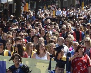 Graduands parade up George St during a previous graduation ceremony. PHOTOL: GERARD O’BRIEN