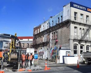 Contractors working on the empty section next door to the Crown Hotel in Rattray St. Photo: Peter...