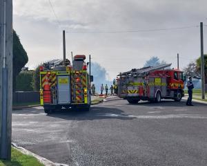 Fire crews and police at the scene of a house fire in Crawford St, Invercargill, yesterday. PHOTO...