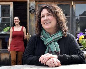 Robyne Saunders (centre) has sold Cafe Santosha, in Port Chalmers, to Sophia Clarke-Edwards who...