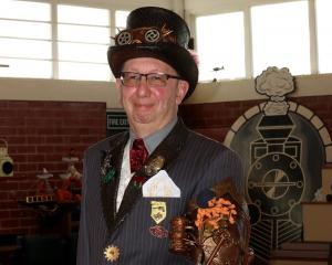 Dunedin Steampunk Society treasurer Allan Benfell shows a robotic arm he created from recycled...