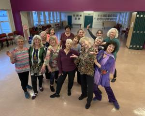 Members of Dunedin’s Ageing Gracefully Dance group surround founders and leaders Suzanne Renner...