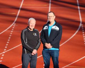 Stepping back from organising duties for the Dunedin Marathon are Ian McDonald (left) and Brian...