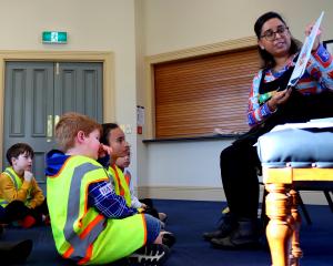 Author Swapna Haddow, of Dunedin, reads her latest book to children from Port Chalmers School....