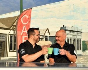 Leandro Massariolo (left) and John Tomkins celebrate opening the only cafe in Tapanui. Photo:...