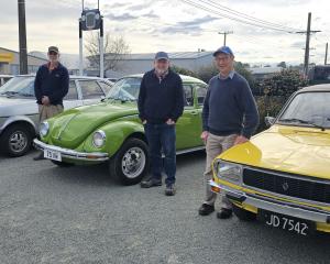 Showing off their continental cars are (from left) Ron Hammer (1984 Renault 20), Brian Roycroft ...