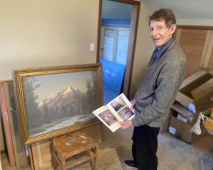 Painter Andrew Trotter inspects how one of his original paintings compares to the printed version...