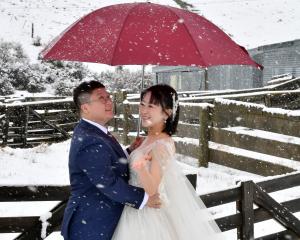 Drs Alison Ou and Crystal Sun pose for wedding photos in the Lindis Valley. PHOTO: STEPHEN JAQUIERY