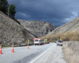 Emergency services attend a crash involving two vehicles in the Lindis Valley yesterday morning....