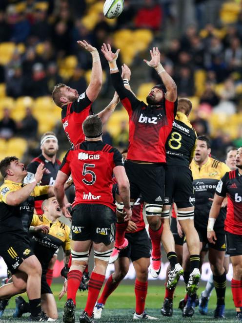  Luke Romano and Jordan Taufua of the Crusaders compete for a loose ball. Photo: Getty