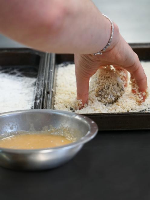 Roll ice cream ball in egg and breadcrumbs.