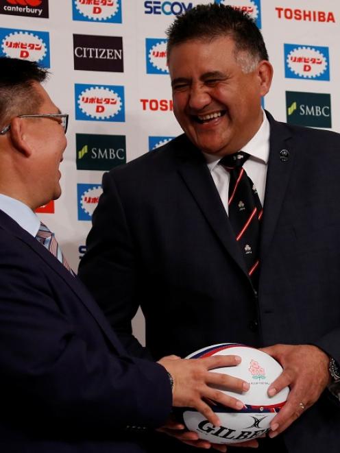 Jamie Joseph (R) and Japan's national team director of rugby Masahiro Kunda share a light moment....