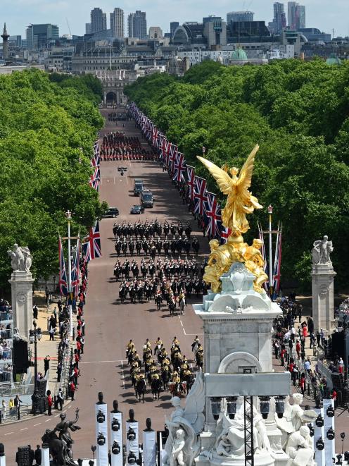 Members of Band of the Household Cavalry ride back along The Mall towards Buckingham Palace....