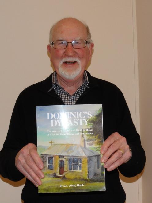 Anthony (Tony) Harris proudly displays a copy of his book. PHOTO: JOSHUA RIDDIFORD