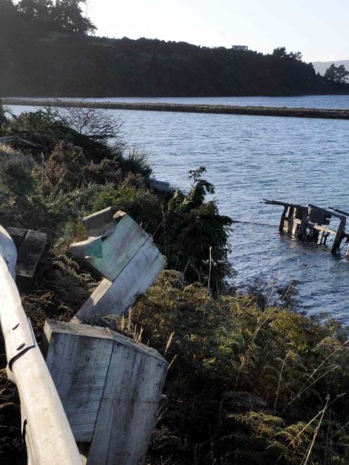 A logging truck lost its trailer which crashed through a barrier and into Blanket Bay early this...