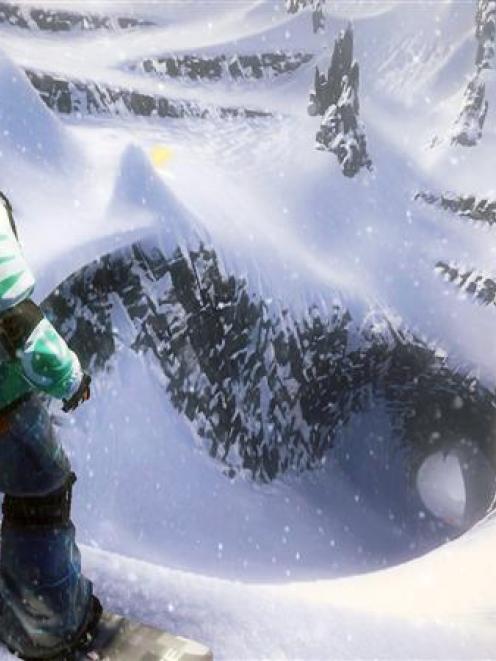 A snowboarder pauses before tackling a mountain in the yet-to-be-released EA Games SSX, which...