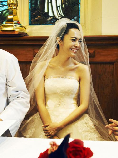 Actress Yao Chen and Cao Yu with the Right Rev Dr David Coles in  St Peter's Church in Queenstown...