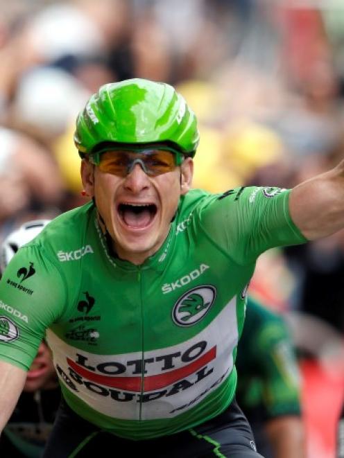 Andre Greipel celebrates as he crosses the finish line to win the 189.5km 5th stage of the Tour...