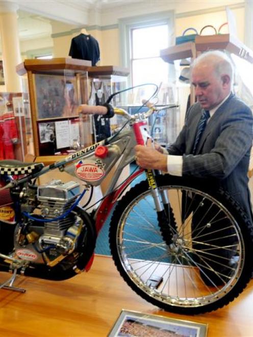 At the New Zealand Sports Hall of Fame yesterday, speedway great Ivan Mauger helps install the...