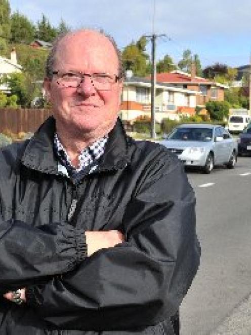Mosgiel-Taieri Community Board chairman Bill Feather checks out the traffic in Quarry Rd, near...