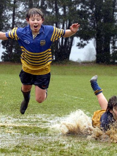 But Tim O'Connor-Varcoe (11) and Christian Henderson (13) get wet and have fun anyway yesterday...