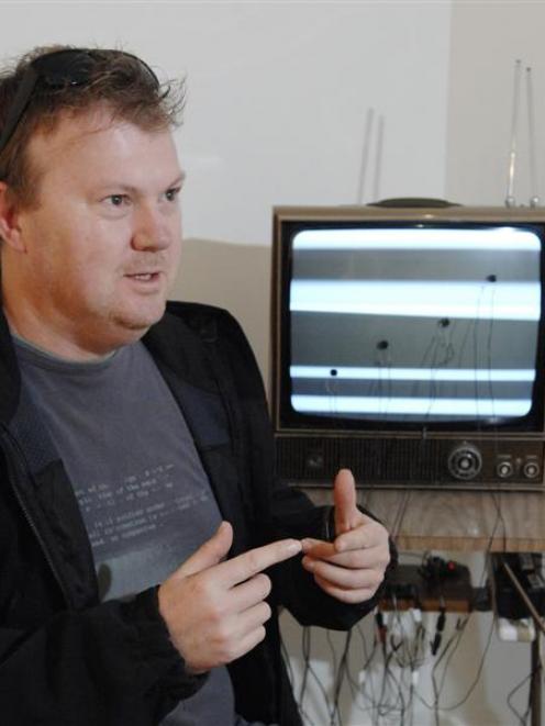 Dunedin artist Pete Gorman with his audio-visual sculpture Heteroclite yesterday. Photo by Linda...