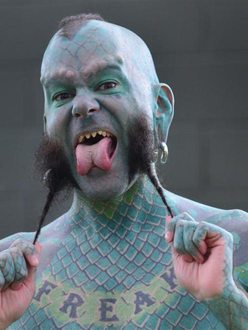 Erik ''The Lizardman'' Sprague displays his body modifications in Mosgiel yesterday. Photo by...