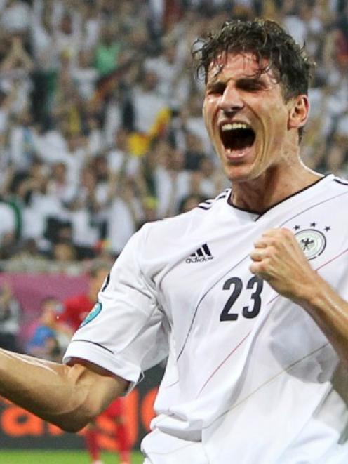 Germany's Mario Gomez celebrates after scoring against Portugal during their Group B Euro 2012...