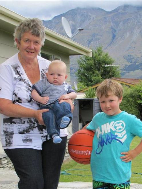 Glenorchy resident Jenny Keogh with her two grandsons visiting for a summer holiday, Charlie (4...