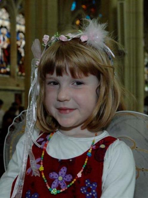 Henrietta Waters (4) is dressed as an angel at the family nativity service in St Paul's Cathedral...