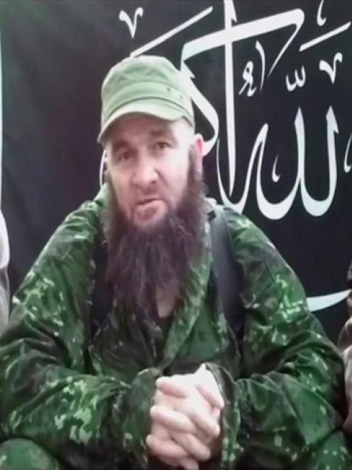 Islamist rebel leader Doku Umarov (C) speaks in a video posted on www.kavkazcenter.com in this...