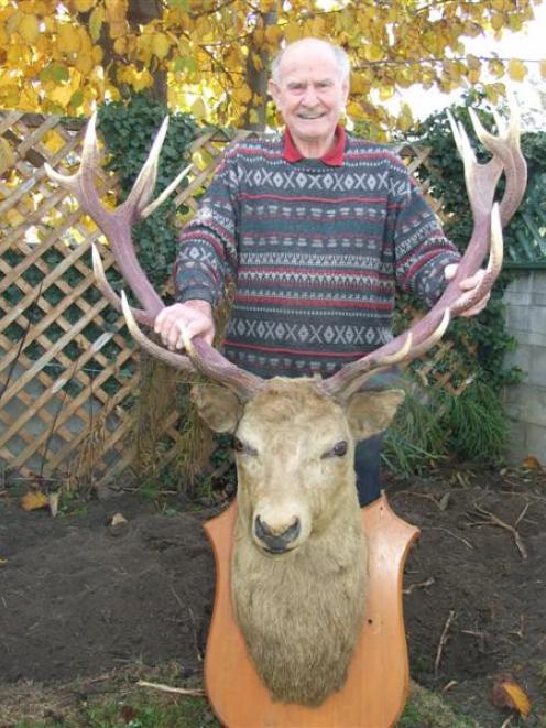 Ken Humphrey with the stag  shot by his father 91 years ago. Photo by Lynda van Kempen.