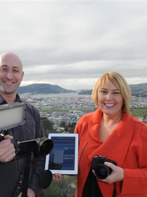 Kyle and Tania Elmer,  of Mana Property Management, with an i-Phone video rig which they use for...