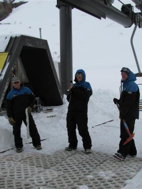 Lift staff (from left) Bruce Cocking, Jarryd Hartshorne and Adam Newman prepare the takeoff area...