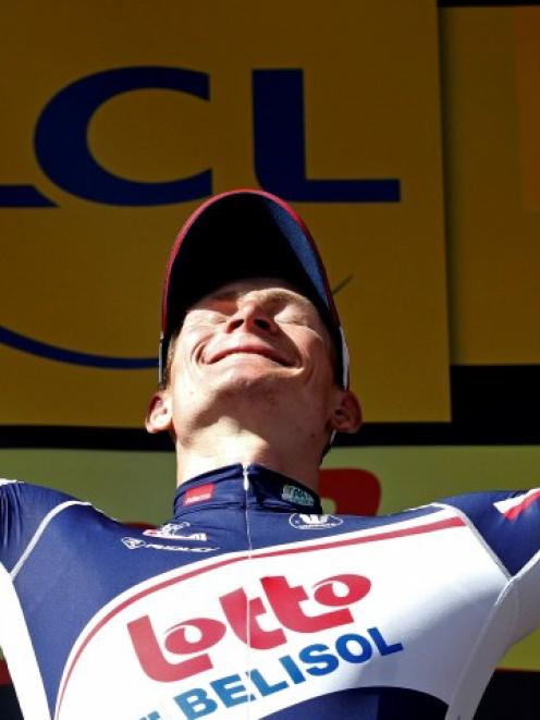 Lotto-Belisol Team rider Andre Greipel of Germany celebrates on the podium after winning the...