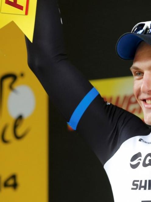 Marcel Kittel celebrates on the podium after winning the third stage of the Tour de France, from...