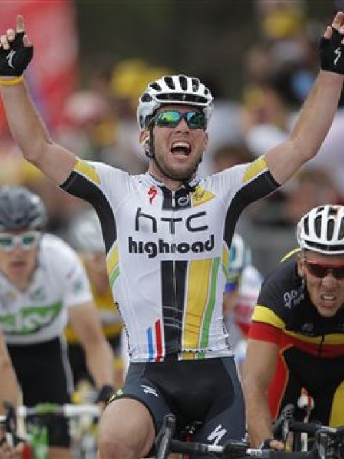 Mark Cavendish of Britain celebrates winning the fifth stage of the Tour de France in Cap Frehel,...