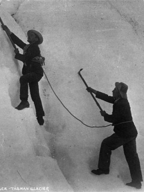Men climbing an ice face on the Tasman Glacier, circa 1890s. Possibly shows George Edward...